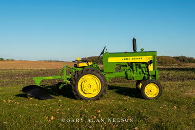 1959 John Deere 330 with a John Deere 411 plow.