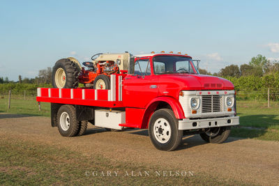 1963 Ford N600 Flatbed carrying a 1951 Ford 8N Tractor