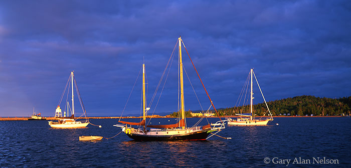 MN-04-78P-LS Morning sun highlighting boats and troubled skies in Grand Marais Harbor, Lake Superior, Minnesota