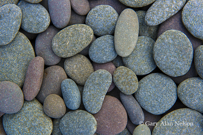 Surf rounded stones on the shore of Lake Superior, Split Rock Lighthouse State Park, Minnesota