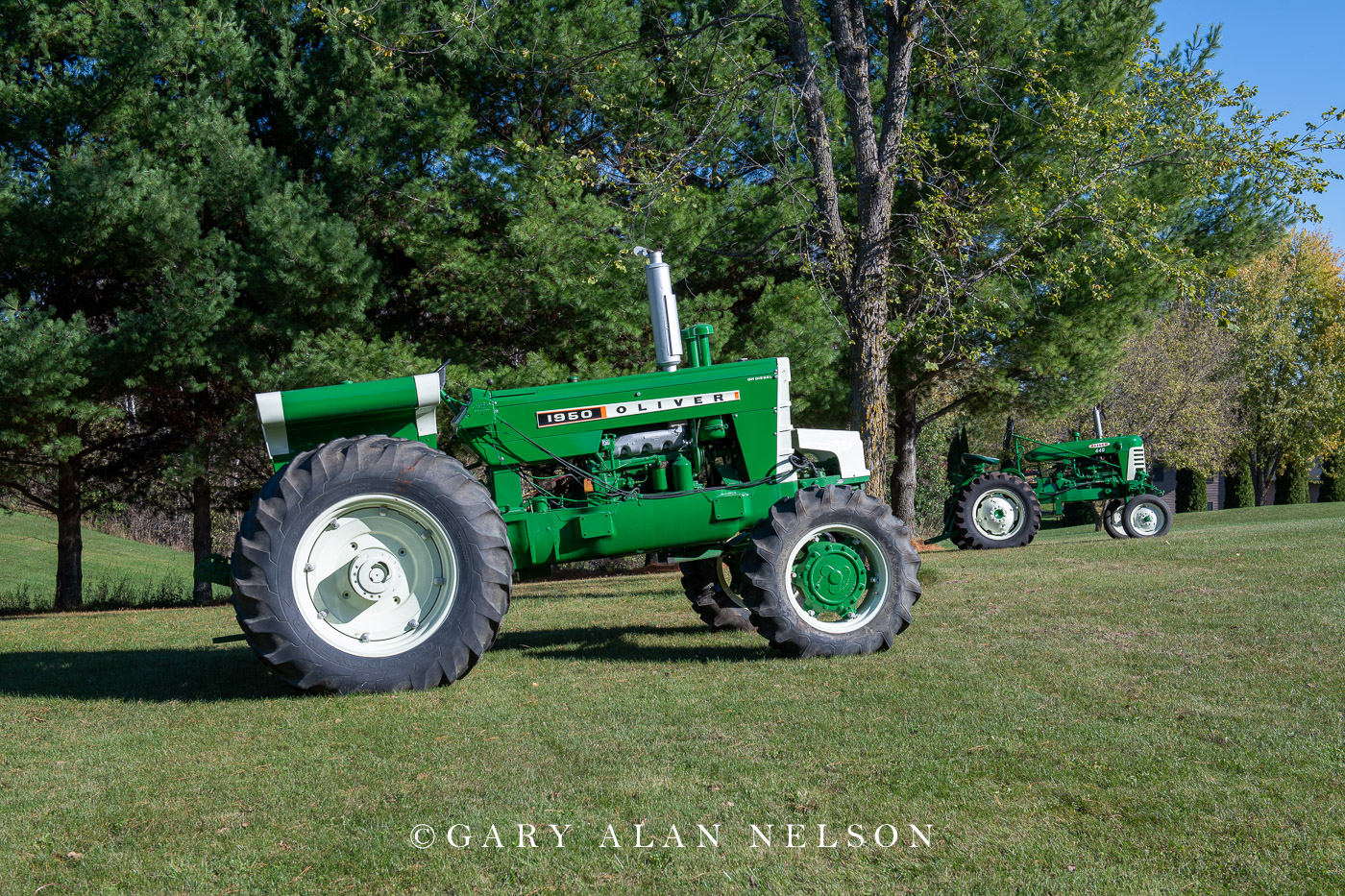 1966 Oliver 1950 with front hydraulic assist, with 1960 Oliver 444 in background.