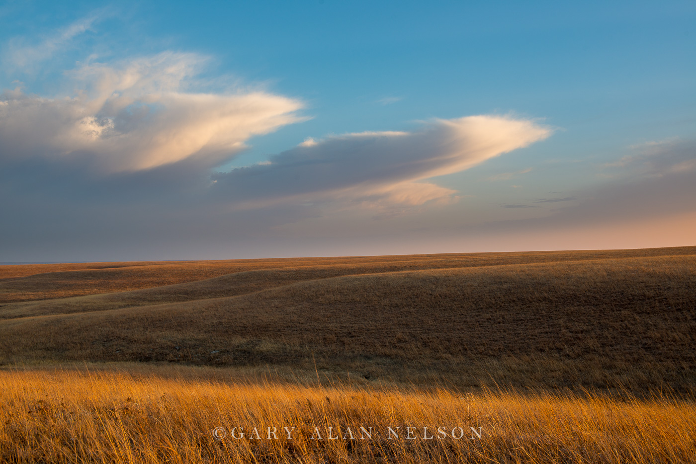 Dusk and clouds over the rolling Tallgrass Prairie National Preserve, Flint Hills, Kansas