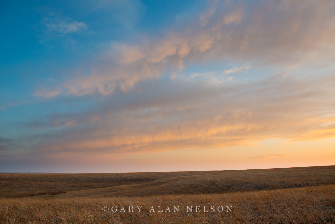 Dusk and clouds over the rolling Tallgrass Prairie National Preserve, Flint Hills, Kansas