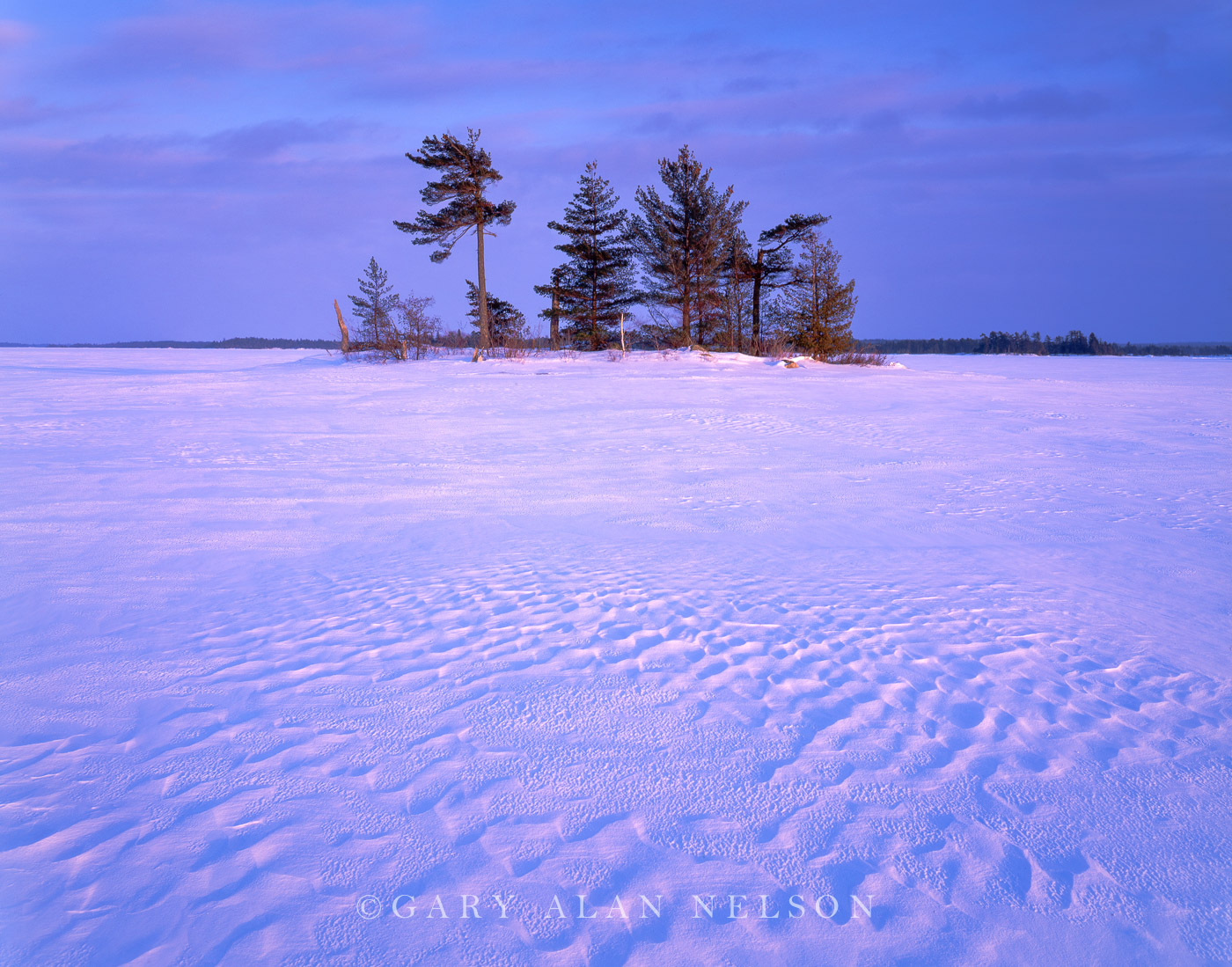 Sculptured snow and island on Rainy Lake, Voyageurs National Park, Minnesota