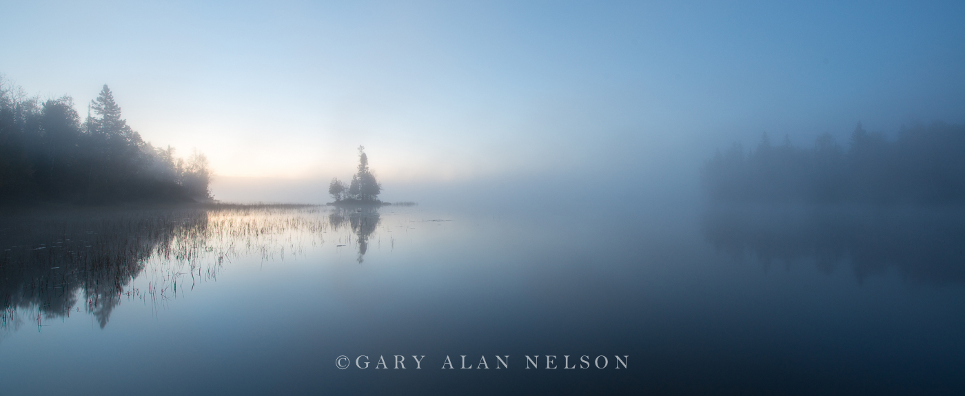 Island and fog at dawn, Superior National Forest, Minnesota