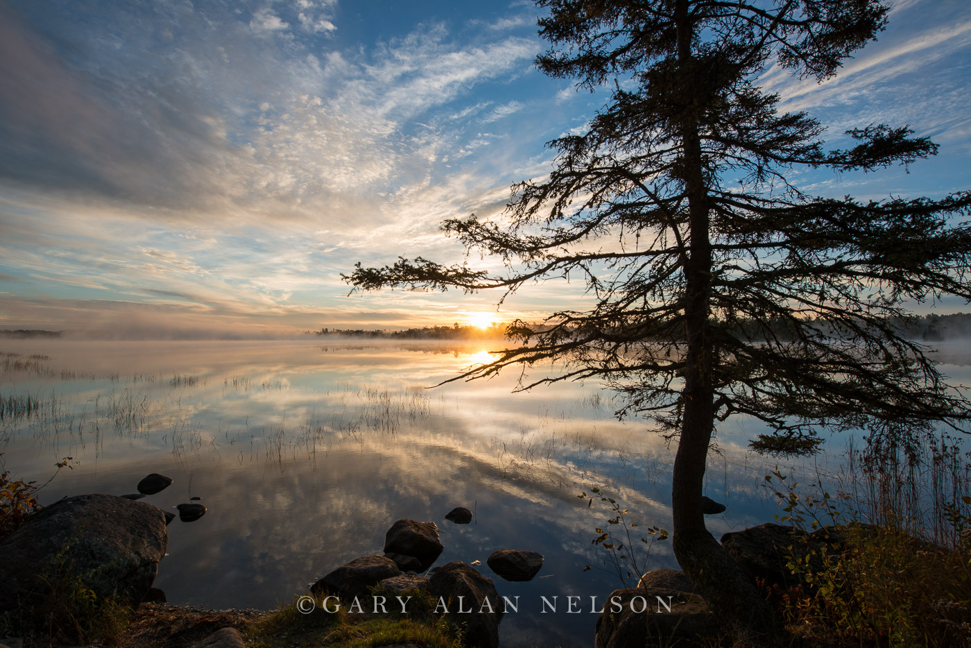 Sunrise over lake, Superior National Forest, Minnesota.