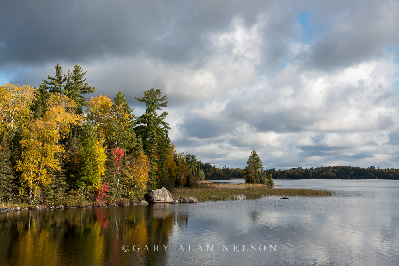 Autumn colors and clouds over the Kawishiwi River, Superior National Forest, Minnesota.