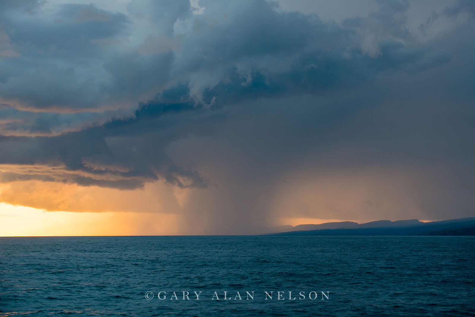 Storm clouds and rain squall over Lake Superior and the Sawtooth Mountains, Grand Marais, Minnesota