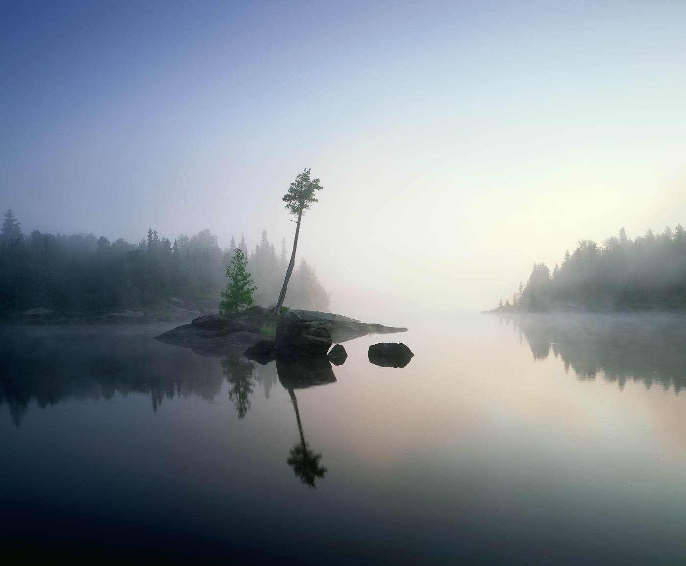 Calm water and fog on Lake Three, Boundary Waters Canoe Area Wilderness, Northern Minnesota