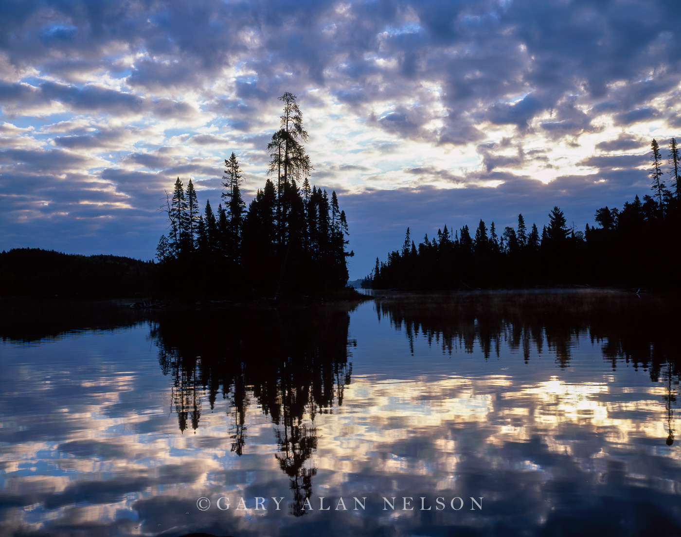 Mackerel skies over Brule Lake, Boundary Waters Canoe Area Wilderness, Minnesota I rarely oversleep when on the job, but on this...