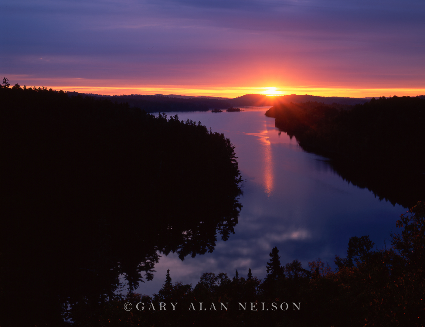 Rising sun over West Bearskin Lake, Superior National Forest, Minnesota