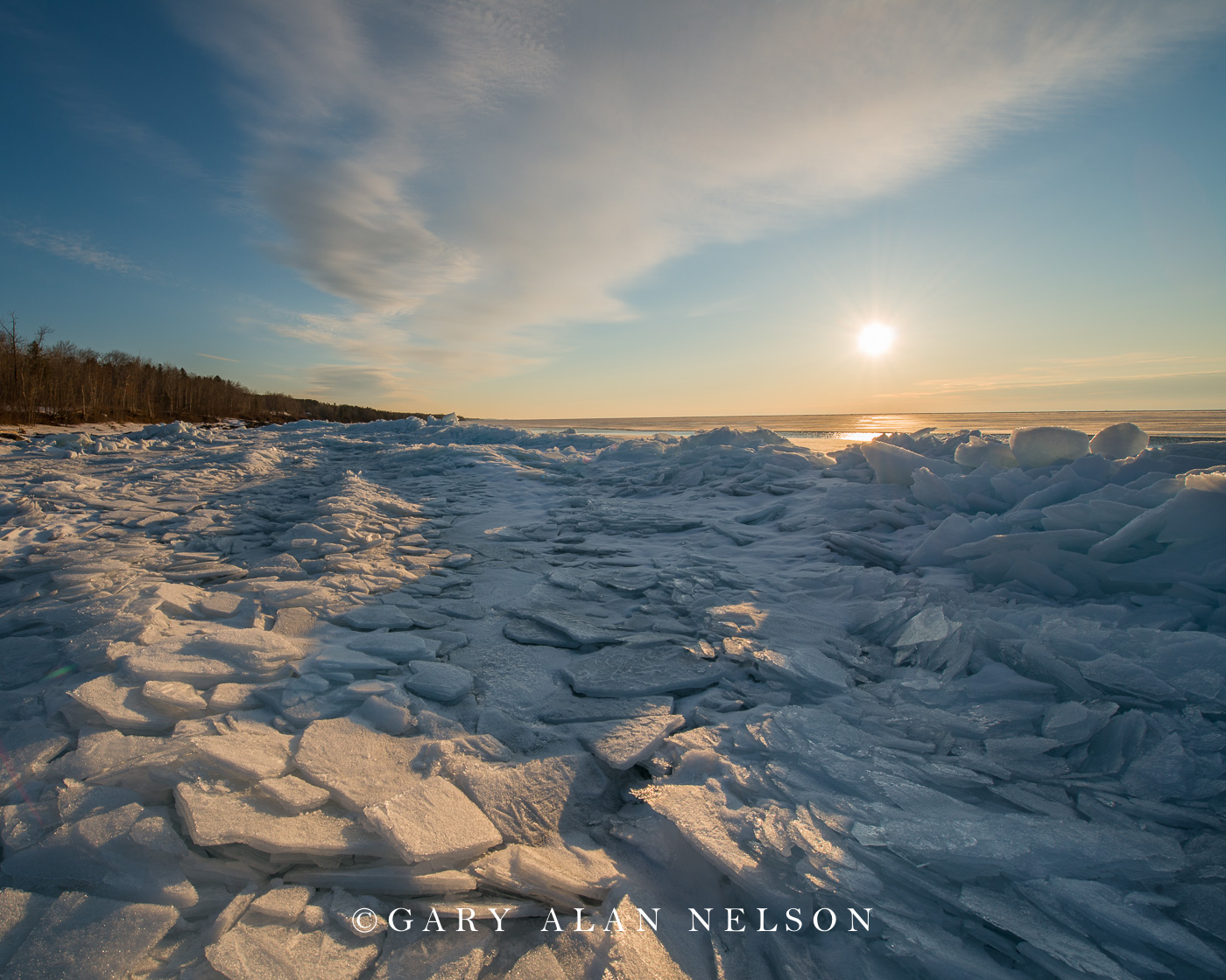 Plates of ice and rising sun over Lake Superior, Minnesota