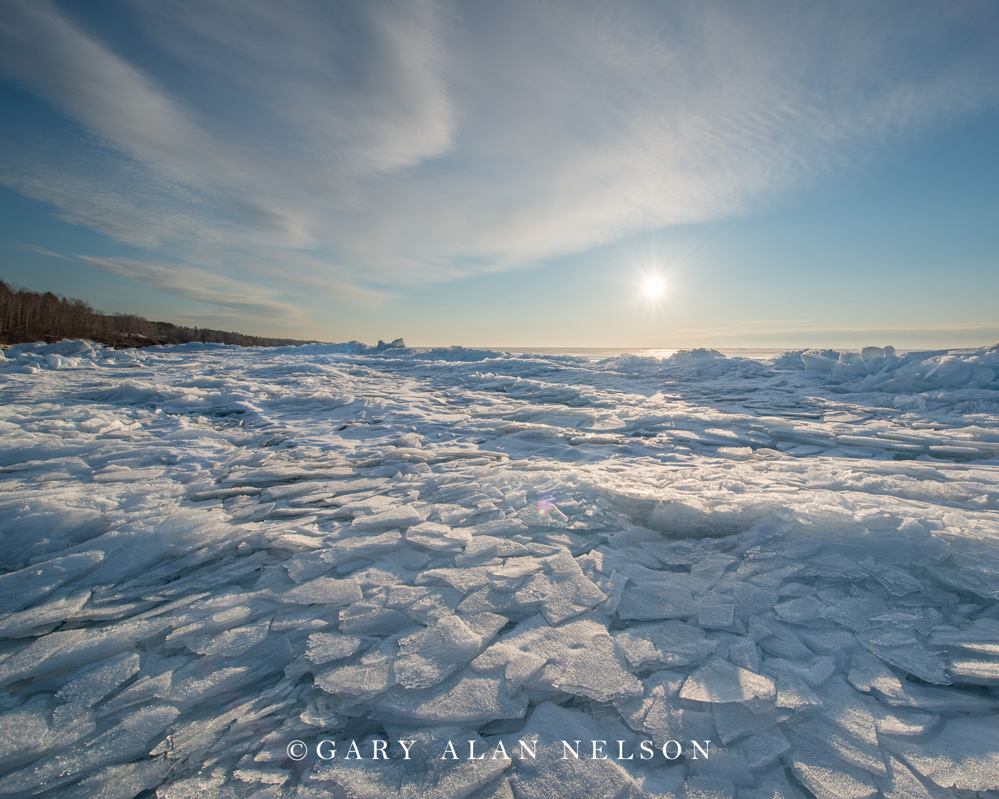 Plates of ice and rising sun over Lake Superior, Minnesota